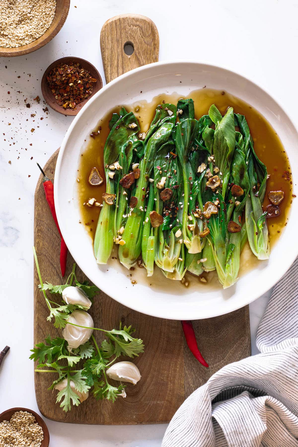 Pak choi with oyster sauce on a plate with garlic and chilli