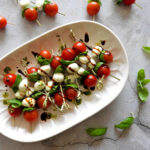 Caprese skewers from overhead on a plate