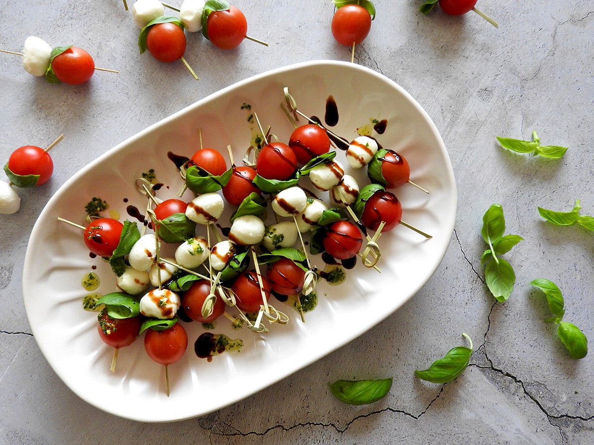 Caprese skewers from overhead on a plate