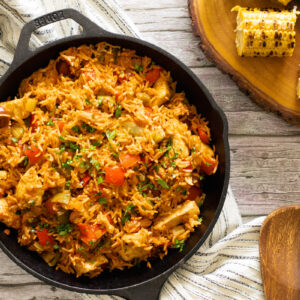 Chicken and chorizo jambalaya in a pan with a spoon