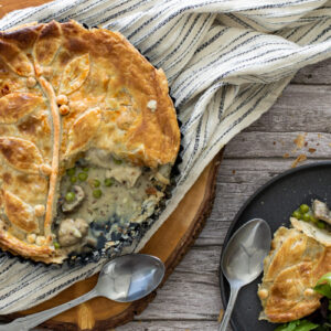 Chicken and mushroom pie spooned onto a plate