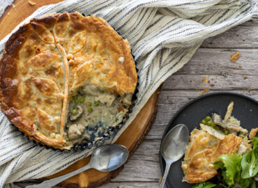 Chicken and mushroom pie spooned onto a plate
