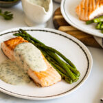 Salmon and asparagus with parsley sauce