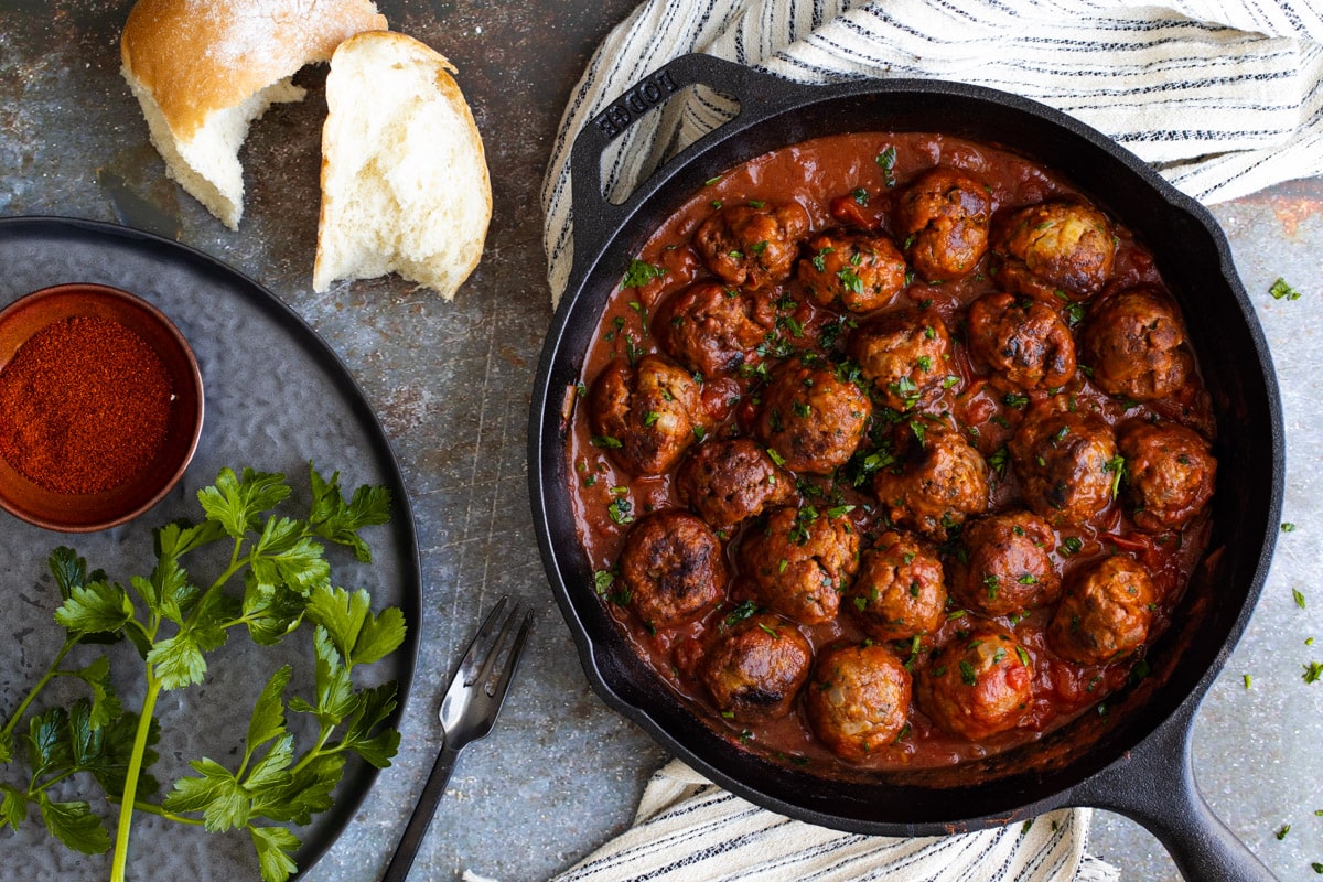 Spanish meatballs in a pan with parsley