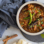 Lamb Bhuna with a napkin and cinnamon