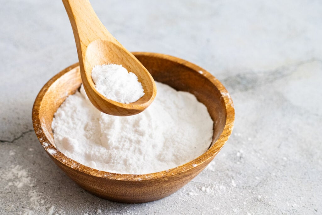 Bicarbonate of soda on a wooden spoon