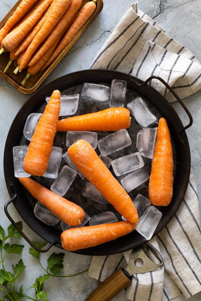 Frozen carrots on ice