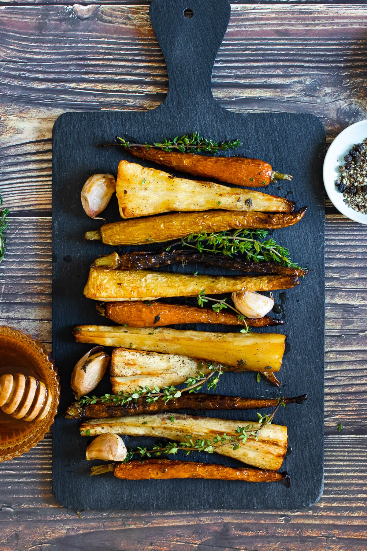 Honey roast parsnips and carrots on a tray