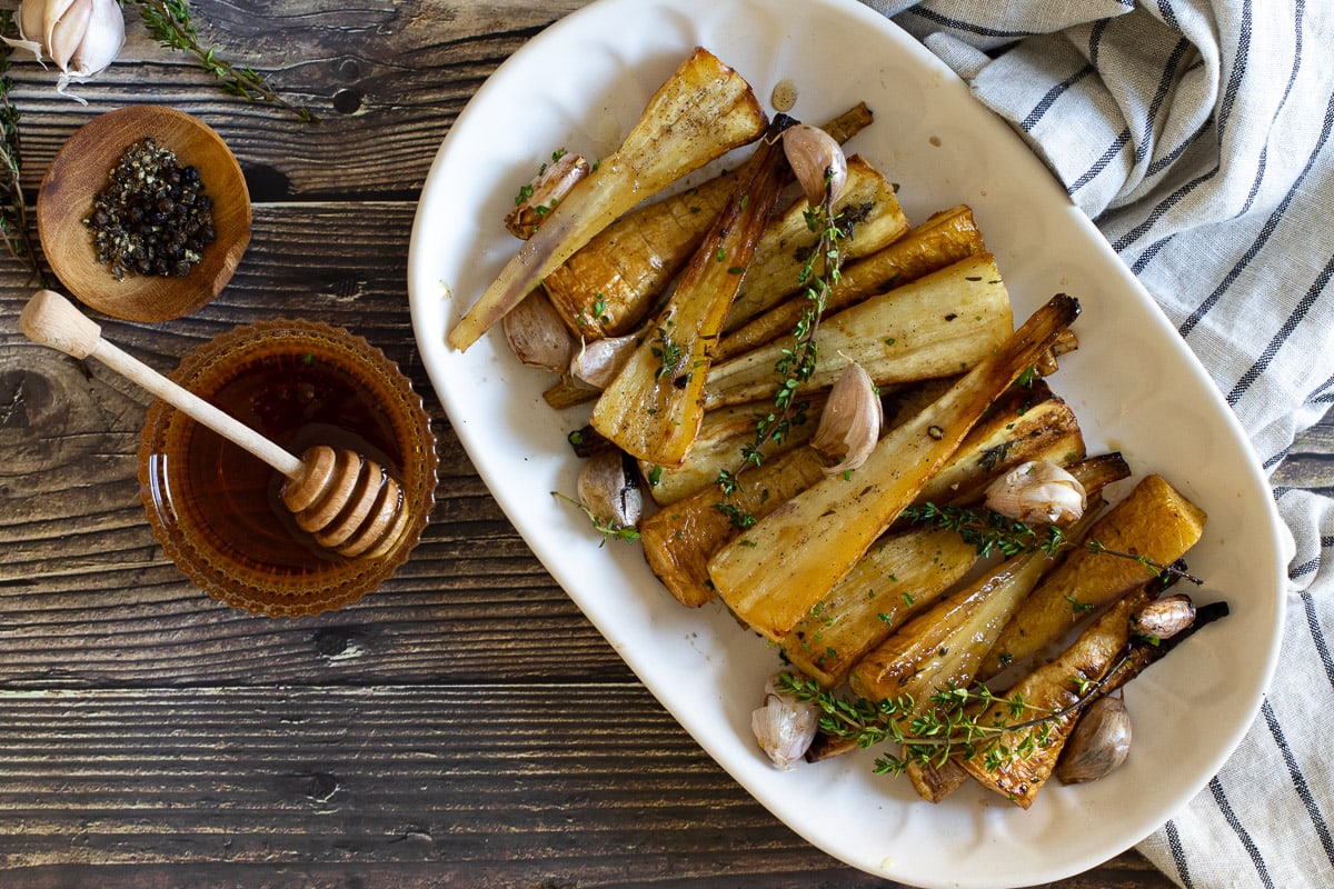 Honey roasted parsnips on a platter