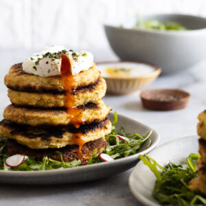 Stacked potato fritters with poached egg